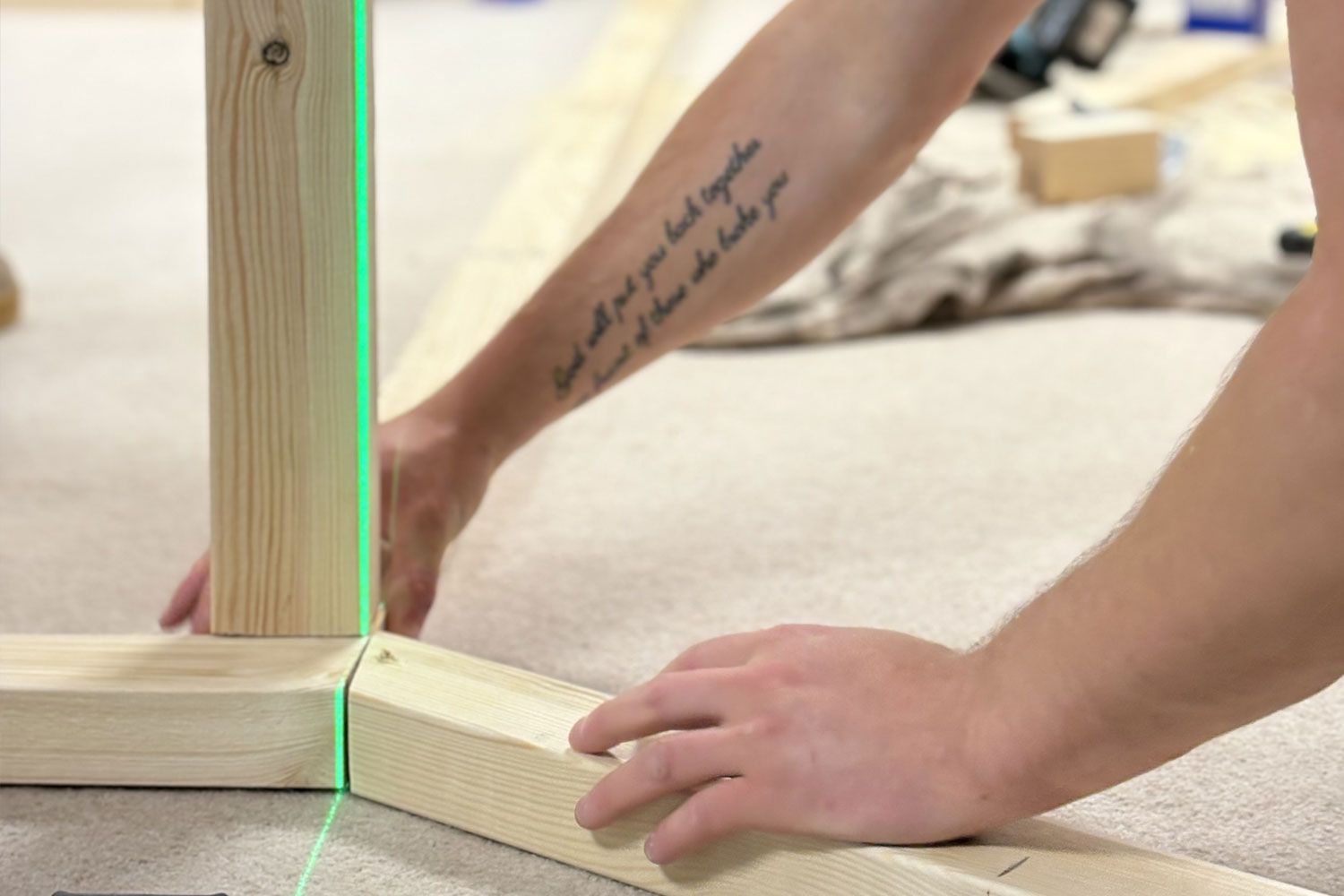 ark carpentry contractors redditch staff member at work fitting timber together